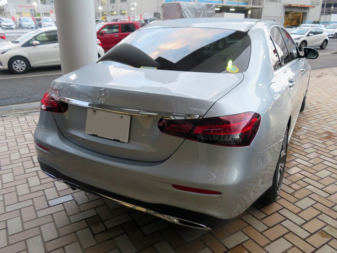 Rear view of a luxury sedan with distinctive taillights and chrome trim