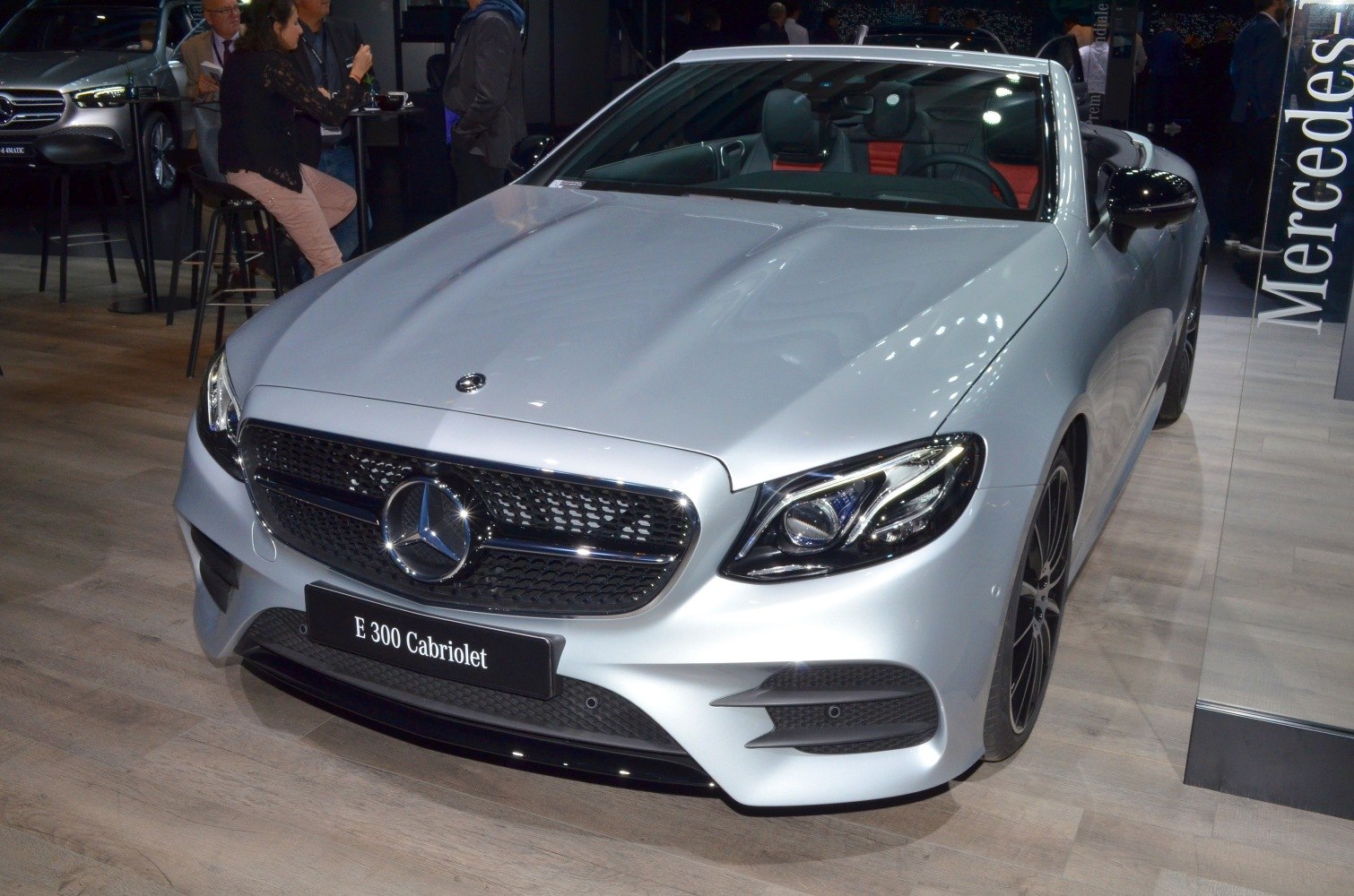 Convertible front view with prominent grille and headlights