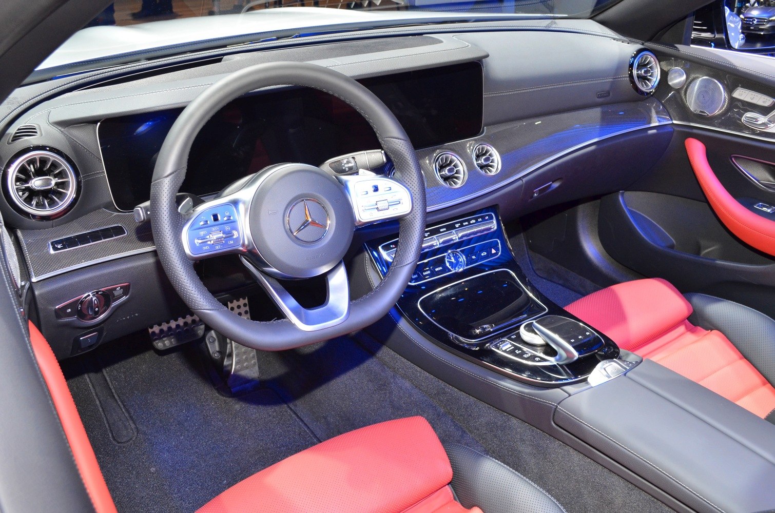 Luxury dashboard and red leather seats with carbon fiber trim