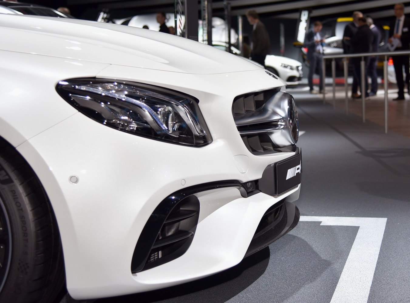 Close-up of front headlight and grille with sleek design