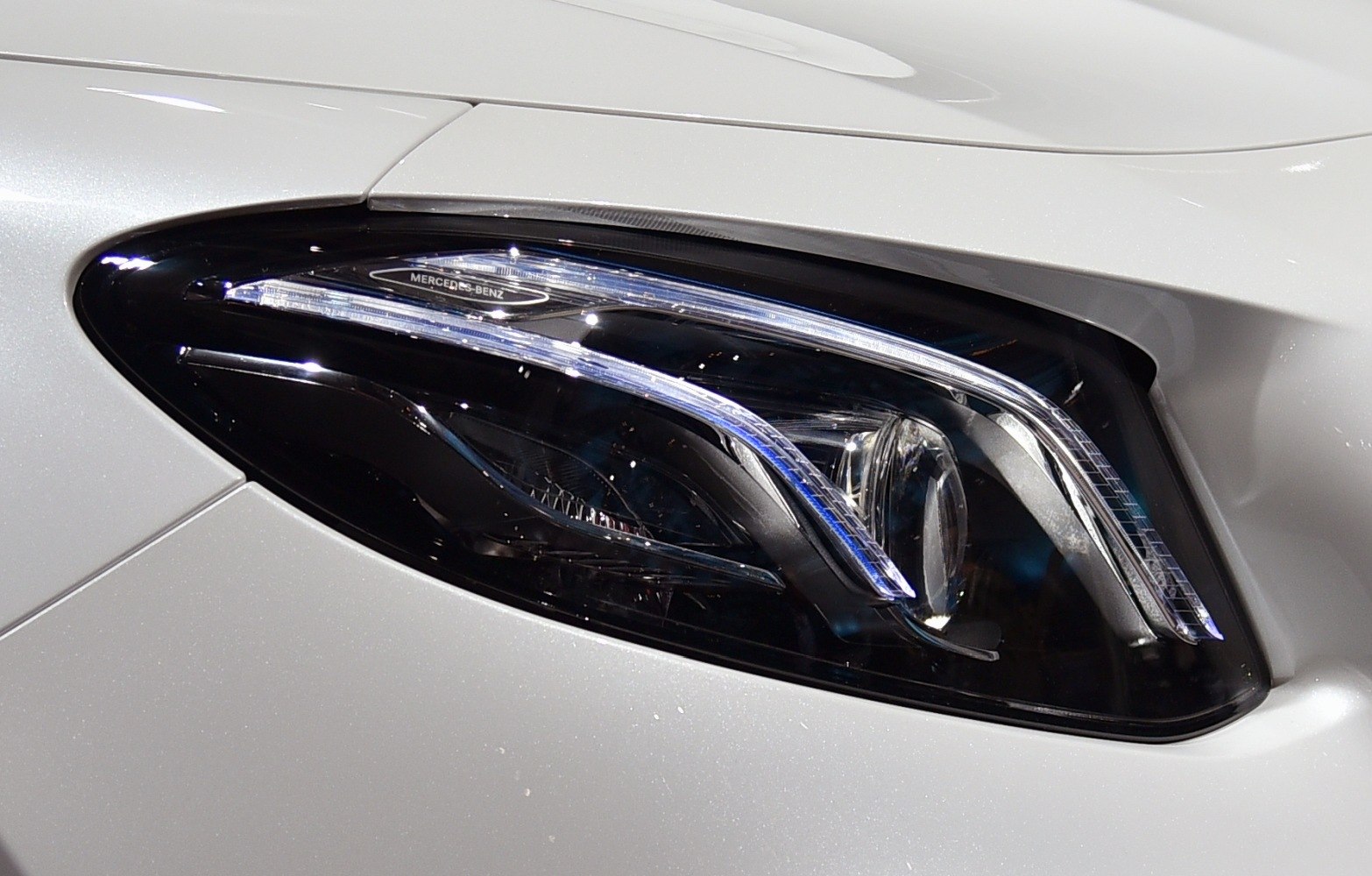 Modern LED headlight with sleek contours and branded detailing