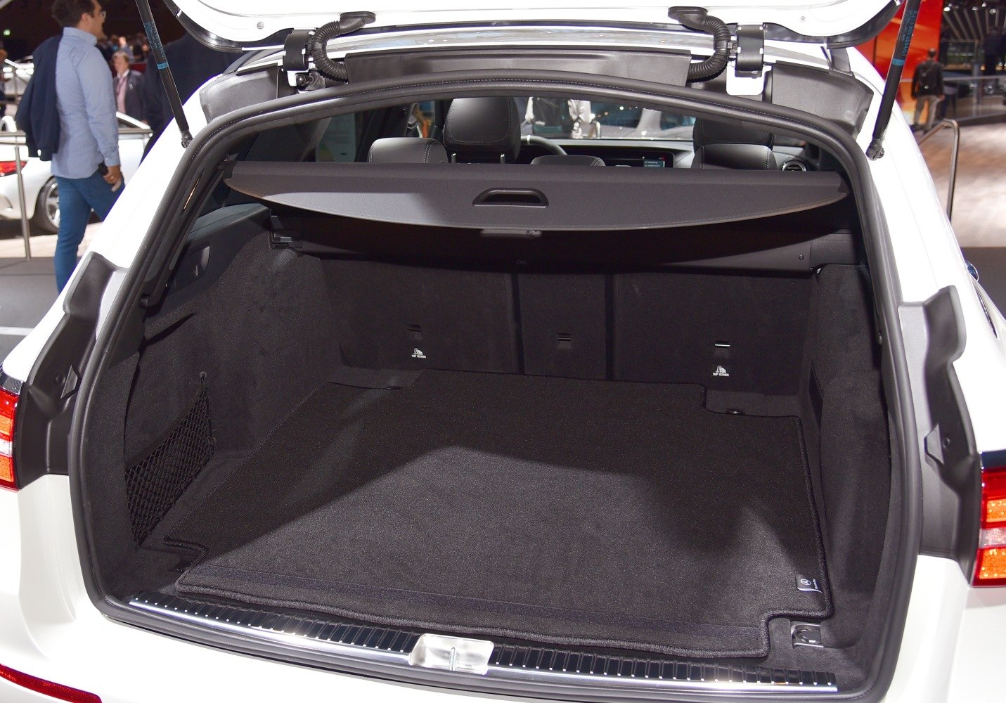 Spacious rear cargo area with protective cover and side netting