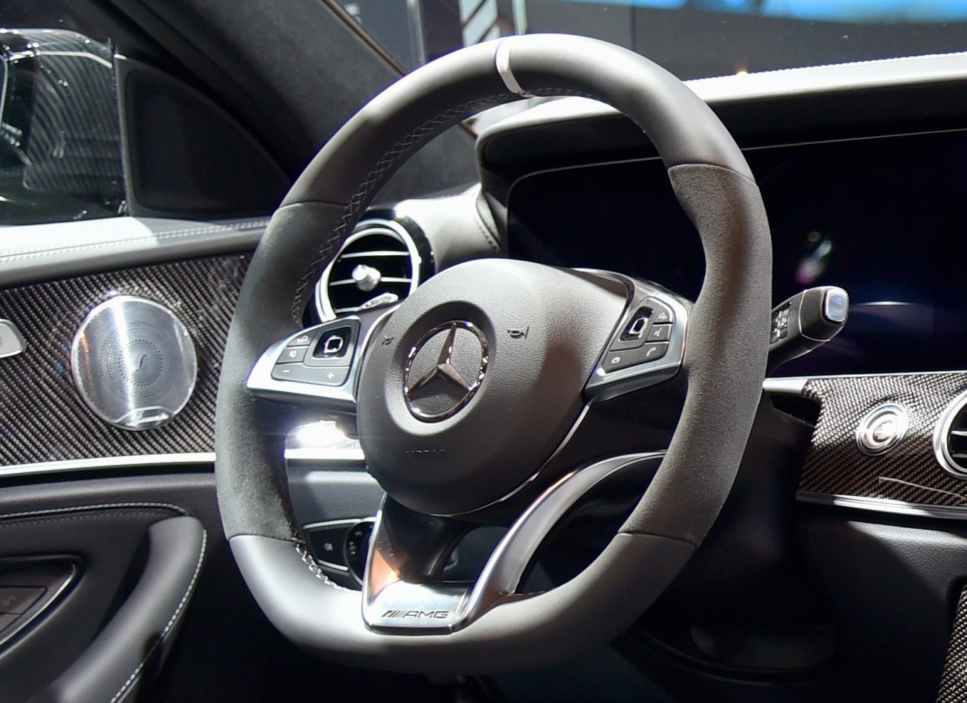 AMG steering wheel and carbon fiber trim in luxury car interior