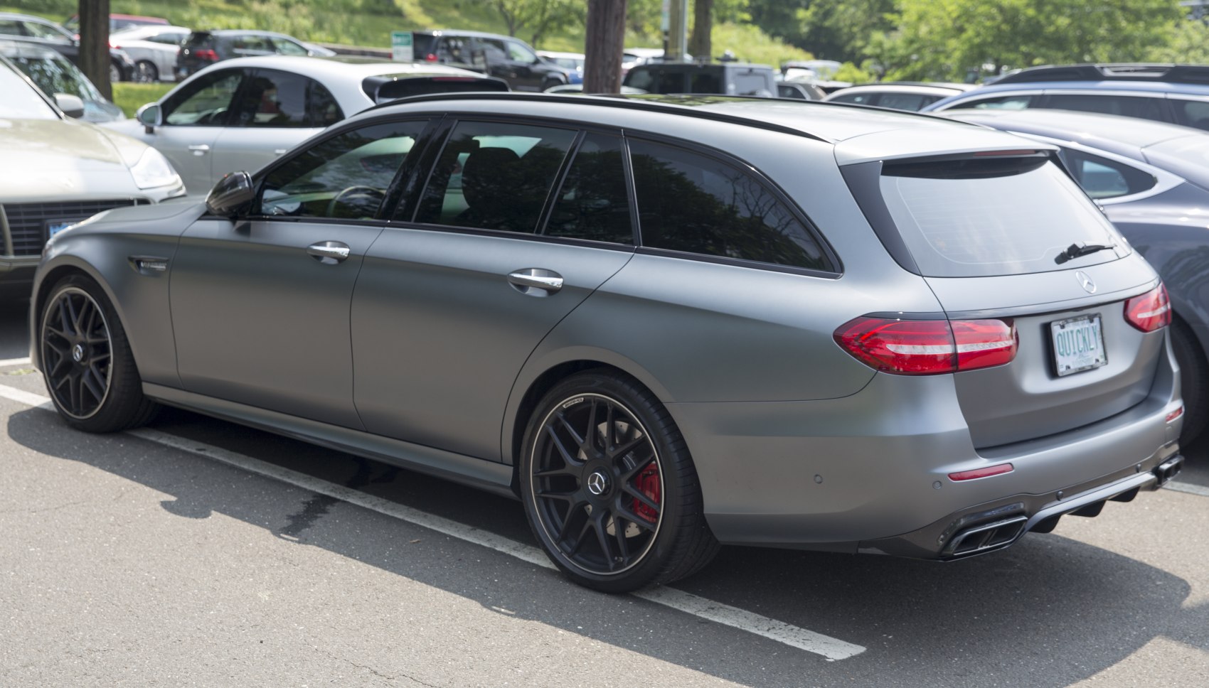 Matte silver estate with black alloy wheels and quad exhaust