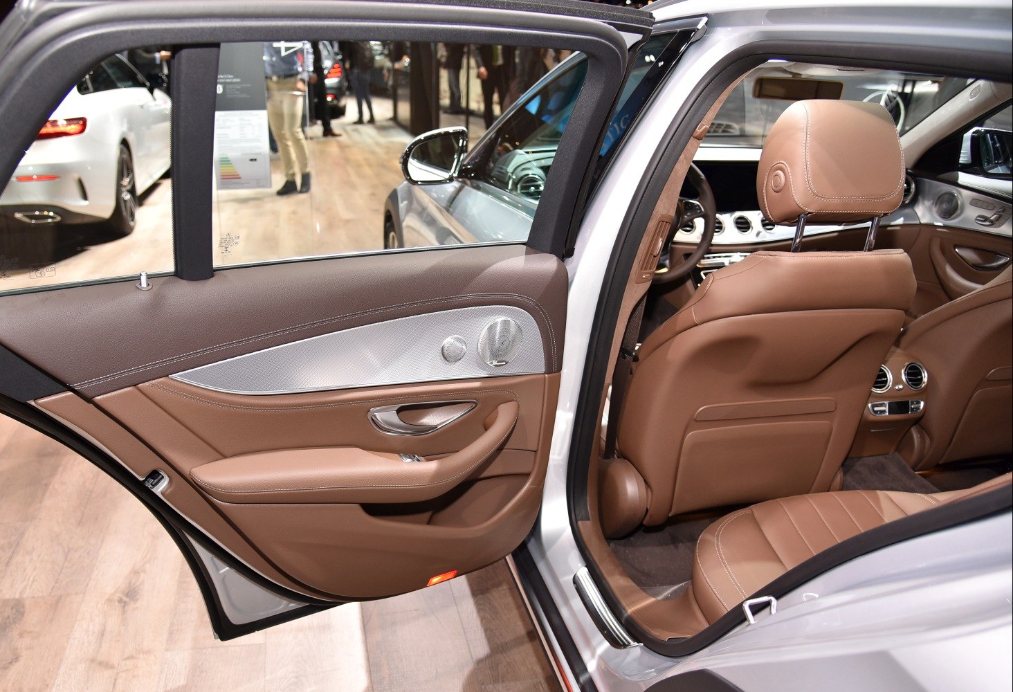 Luxury brown leather rear door and interior with detailed stitching