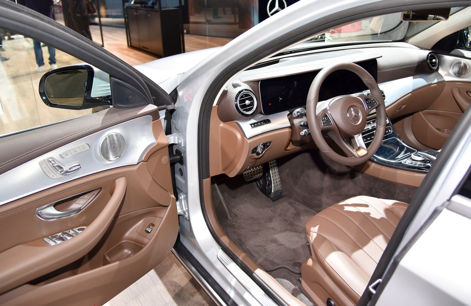 Brown leather interior with advanced dashboard and door panel.
