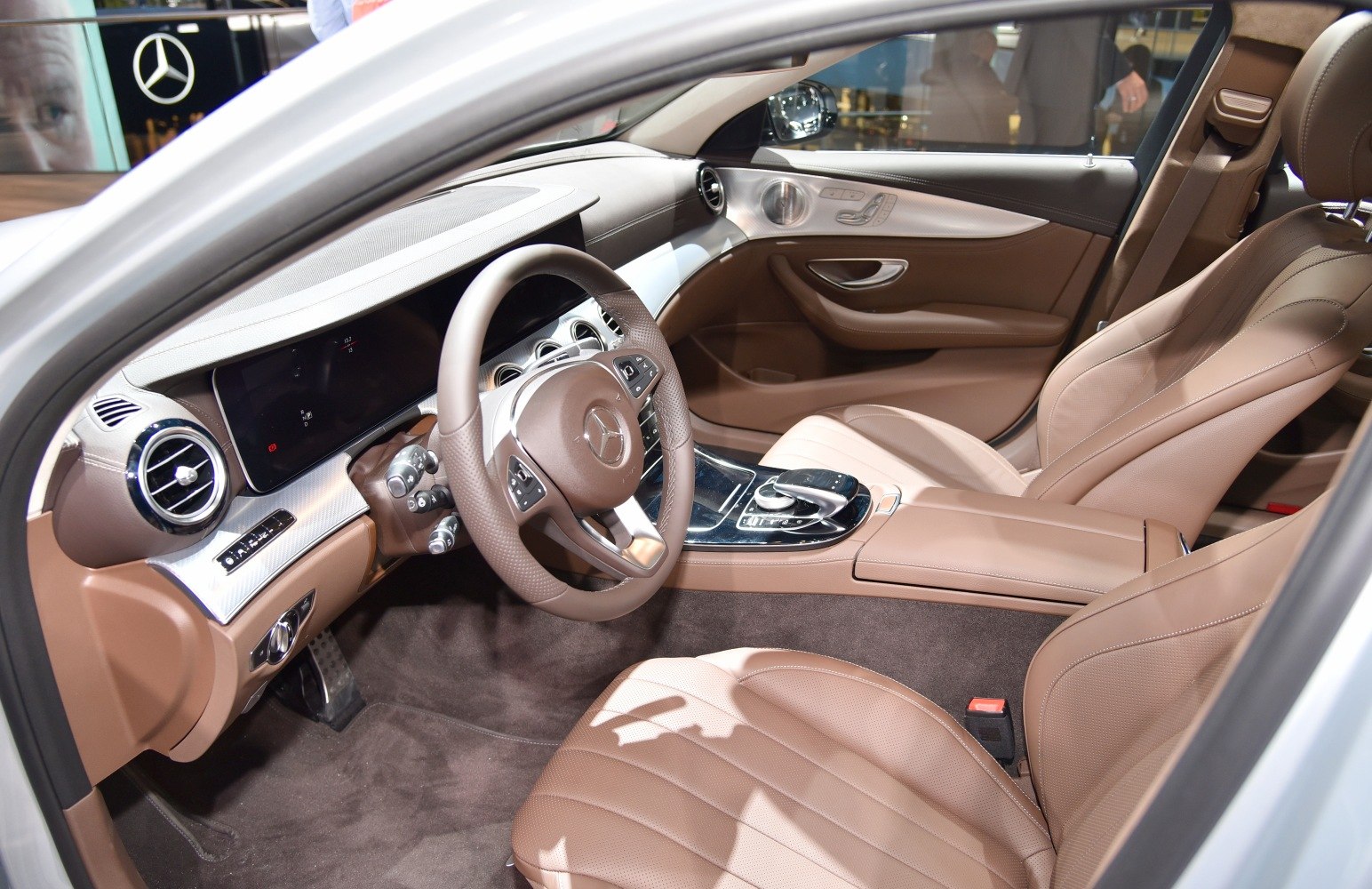 Luxury brown leather seats and modern dashboard with steering wheel