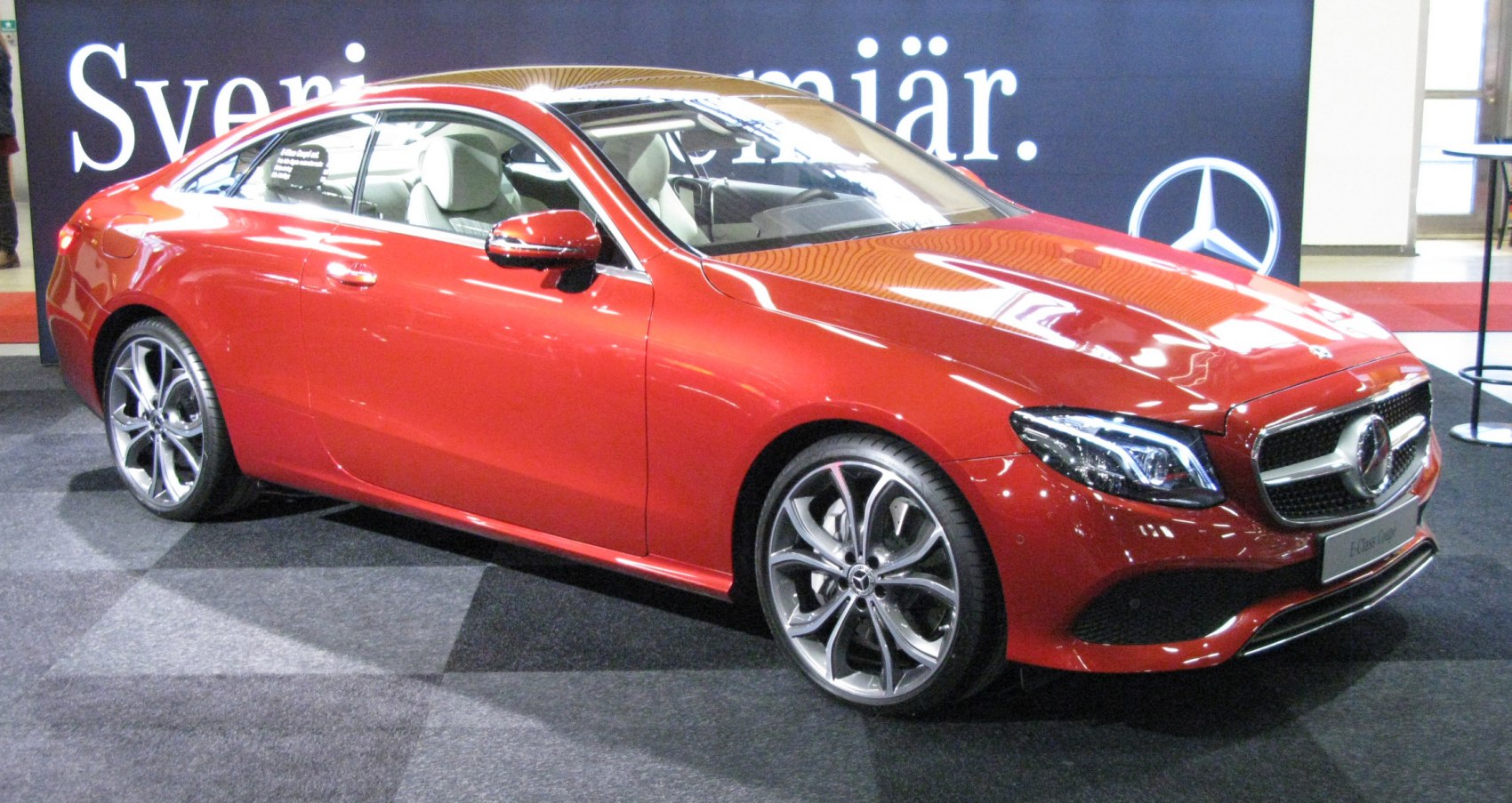 Red luxury coupé with LED headlights and alloy wheels