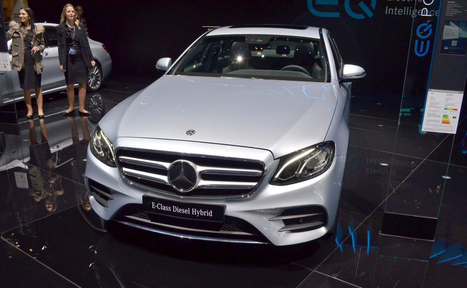 Front view luxury sedan with distinct grille and LED headlights