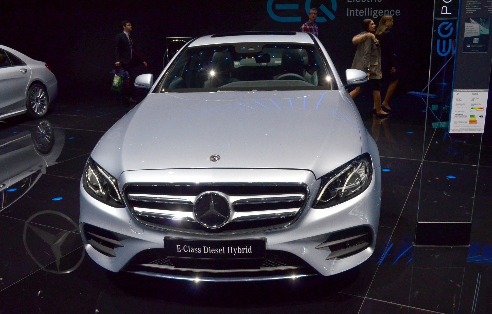 Front view of luxury sedan with prominent grille and diesel hybrid badge