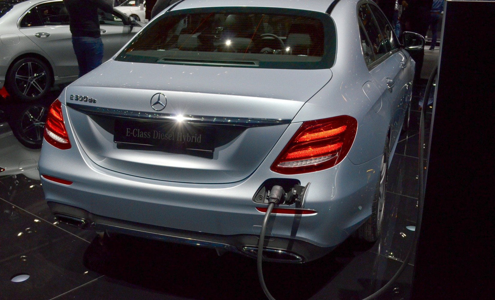 Rear view of sedan with tail lights and charging port