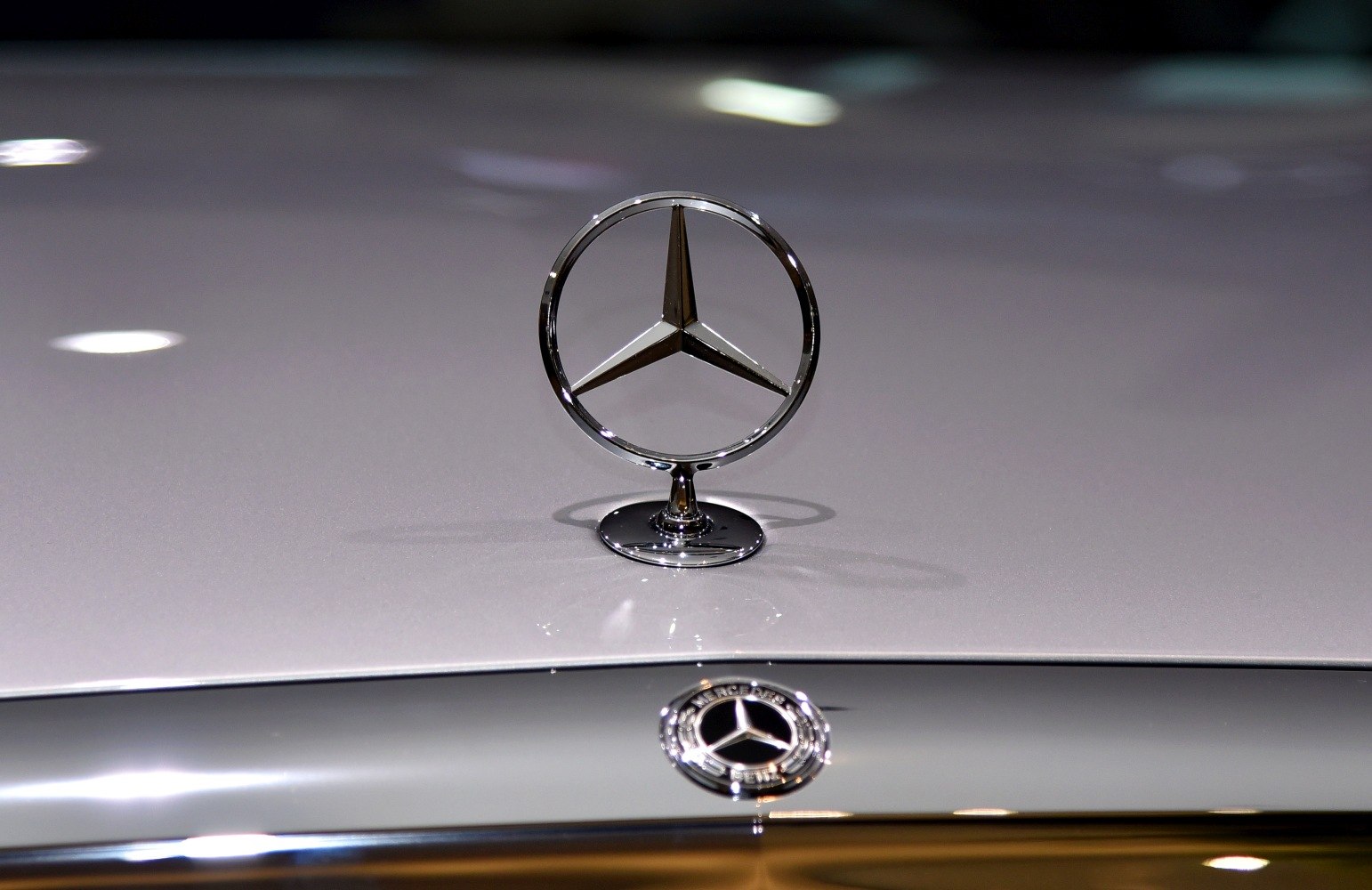 Mercedes-Benz hood ornament and emblem on car front