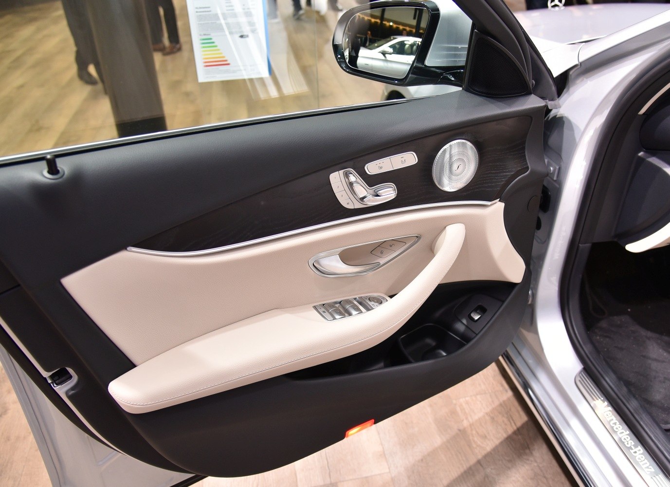 Interior door panel with seat controls and premium speaker grille