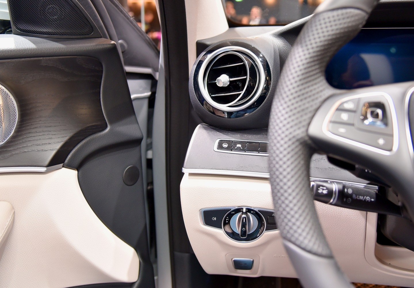 Dashboard air vent and control panel with steering wheel edge