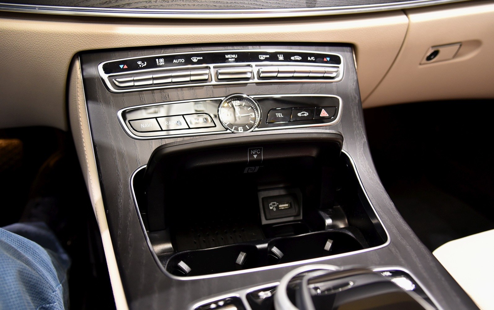 Center console with analog clock and climate/media controls