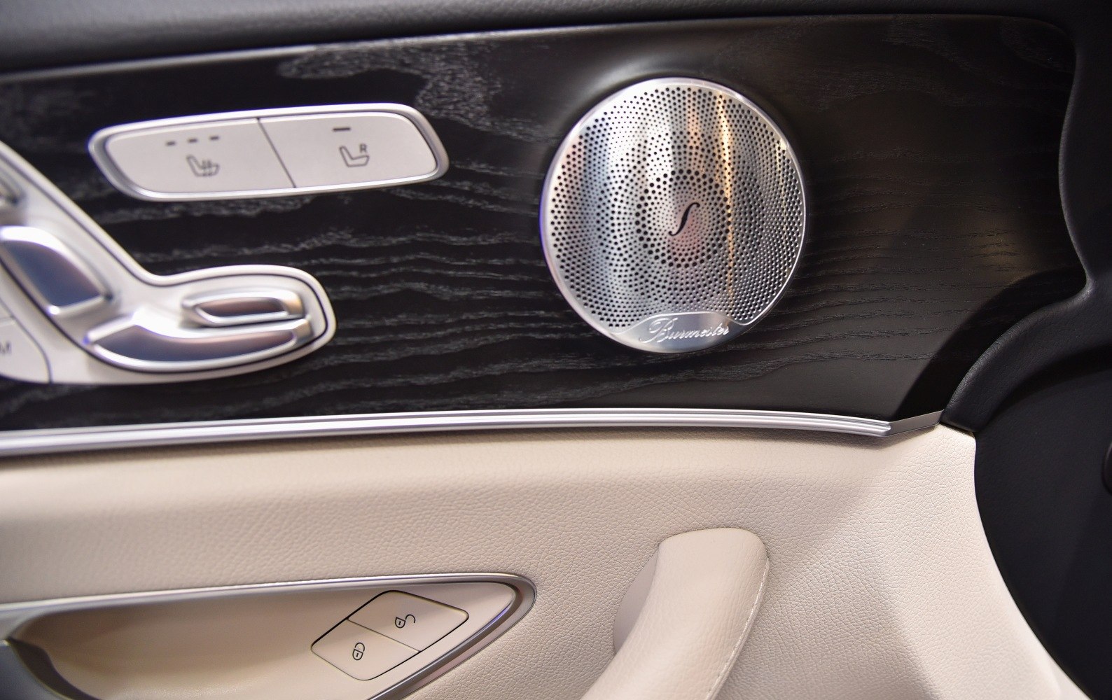 Luxury car door panel with Burmester speaker and seat controls