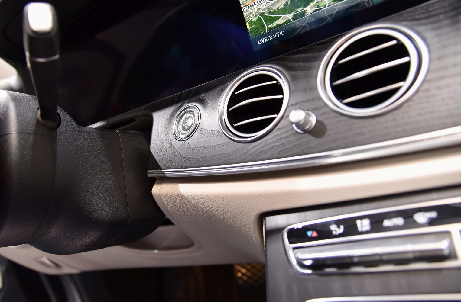 Luxury dashboard air vents, push start button, and infotainment screen