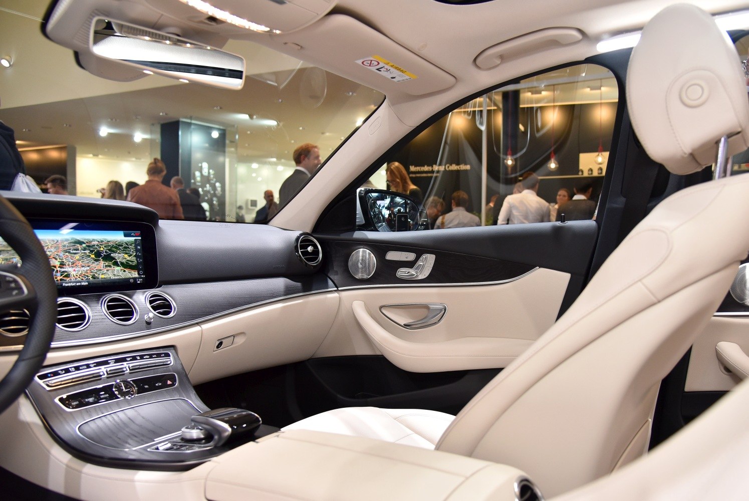 Beige leather seats and dashboard with navigation display