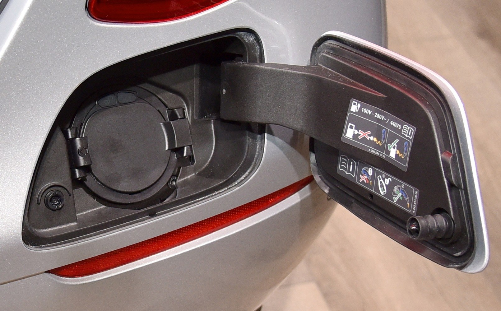 Fuel cap and open fuel door with fuel instructions