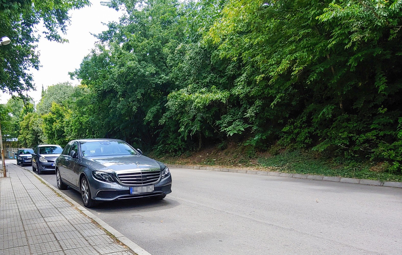 Luxury sedan front fascia with grille and LED headlights