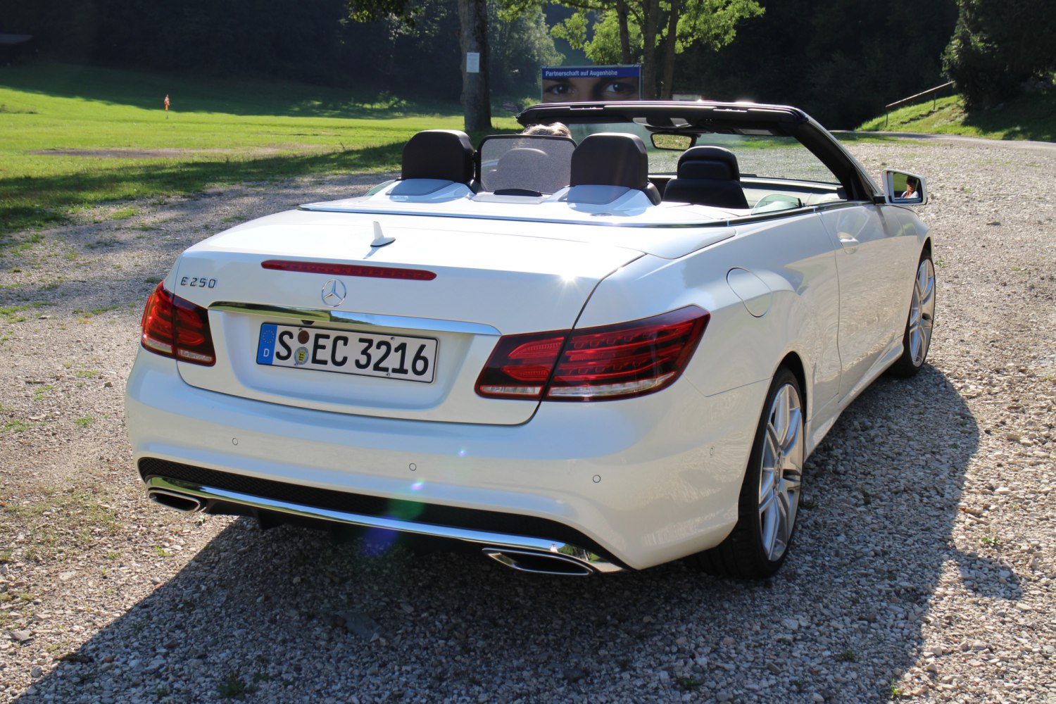 Rear view of convertible with dual exhausts and distinct taillights