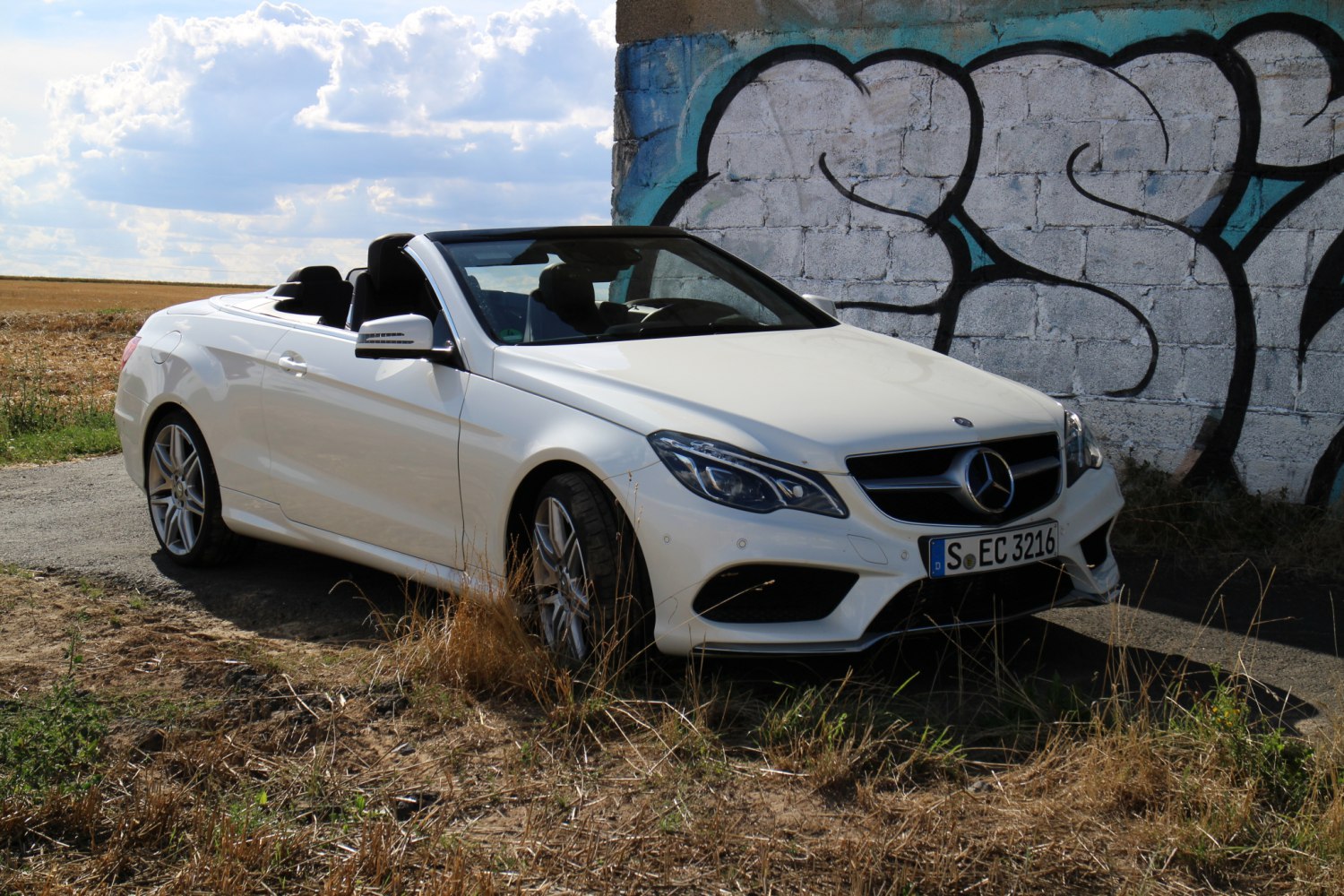 White convertible with sporty front and open roof