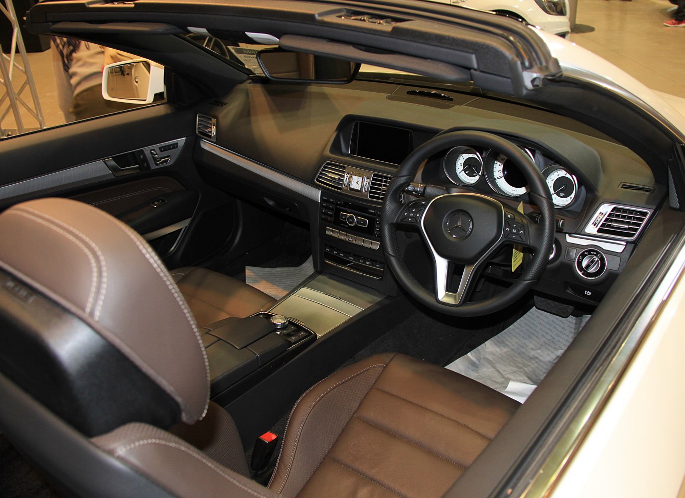 Convertible interior with leather seats and modern dashboard