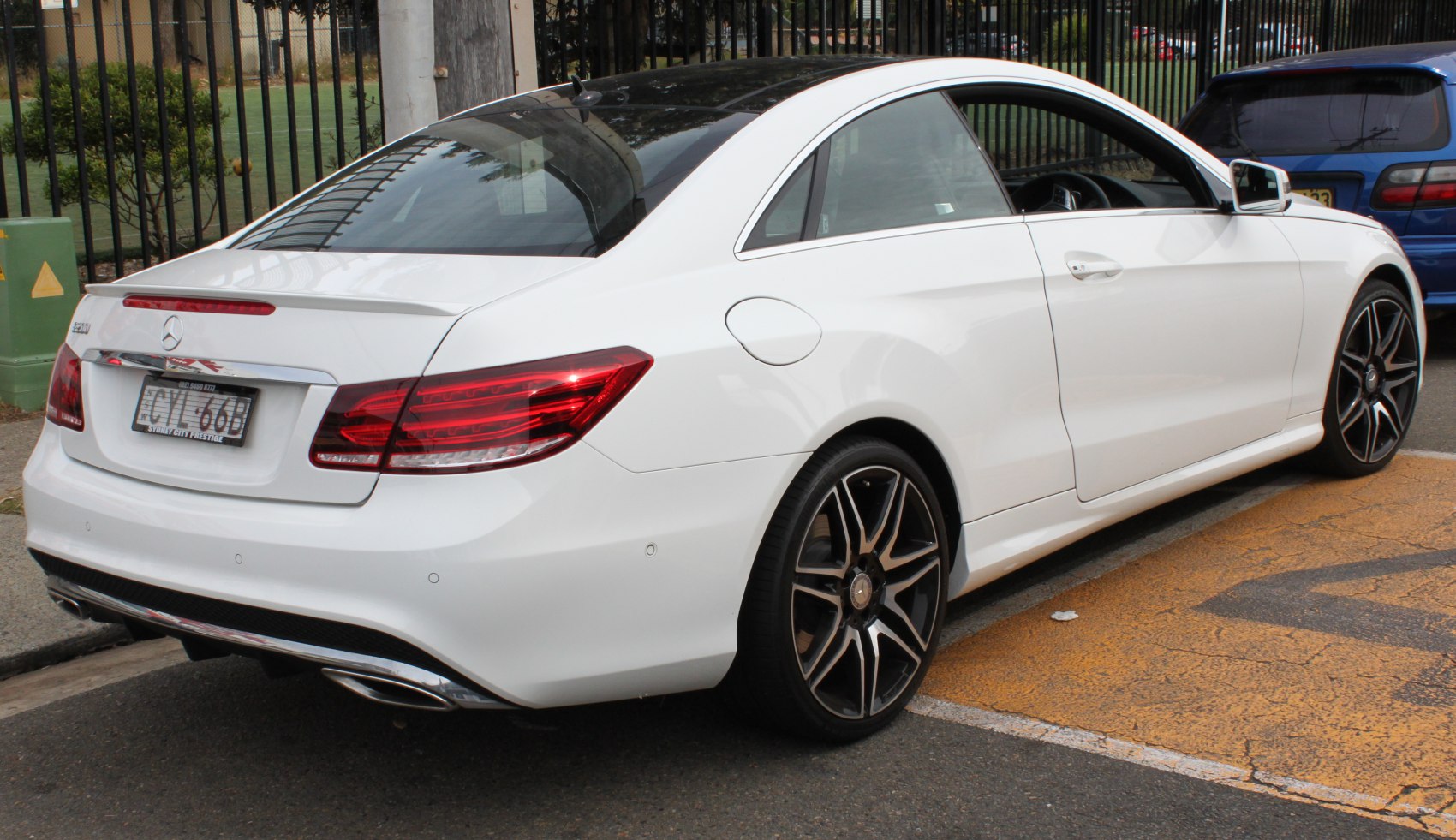 Rear design with signature tail lights and black multi-spoke wheels