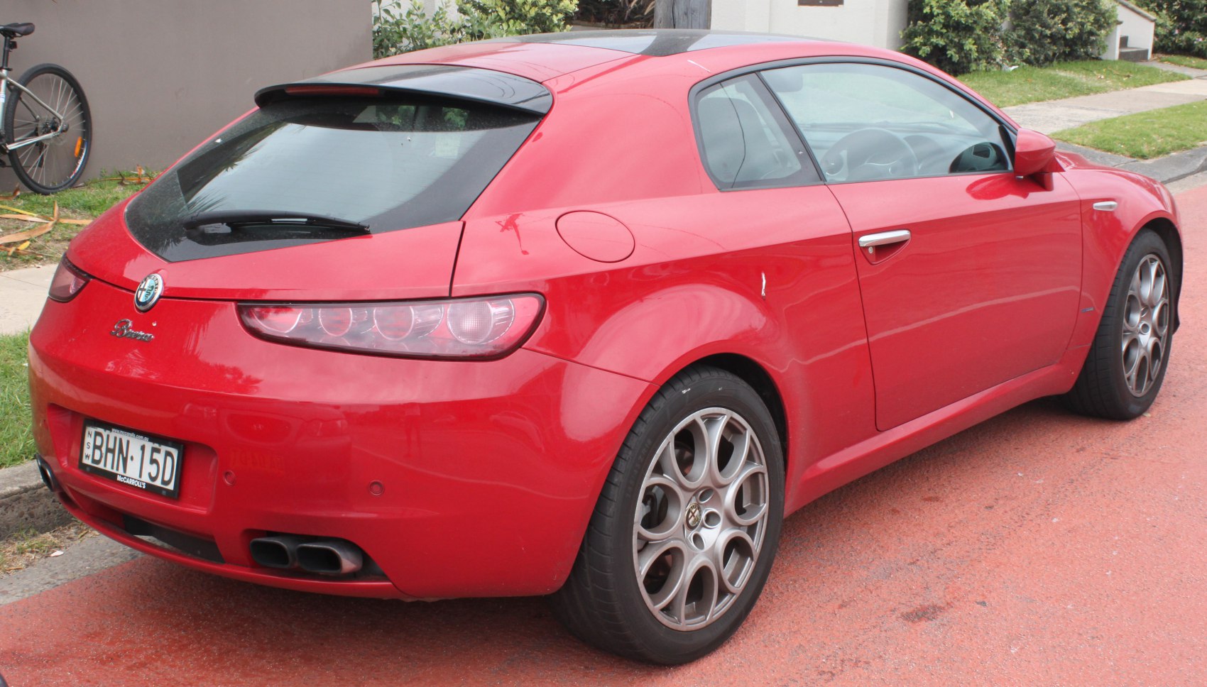 Rear view with distinctive taillights and alloy wheels