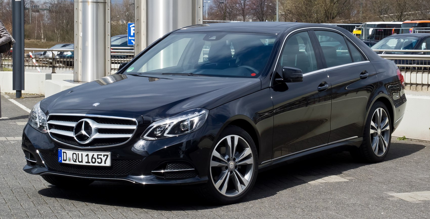 Luxury sedan with LED headlights and multi-spoke alloy wheels