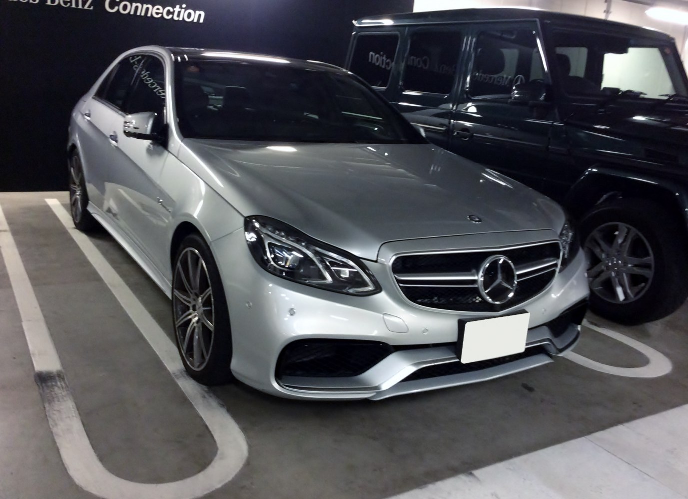 Silver sedan with modern headlights and sporty front grille