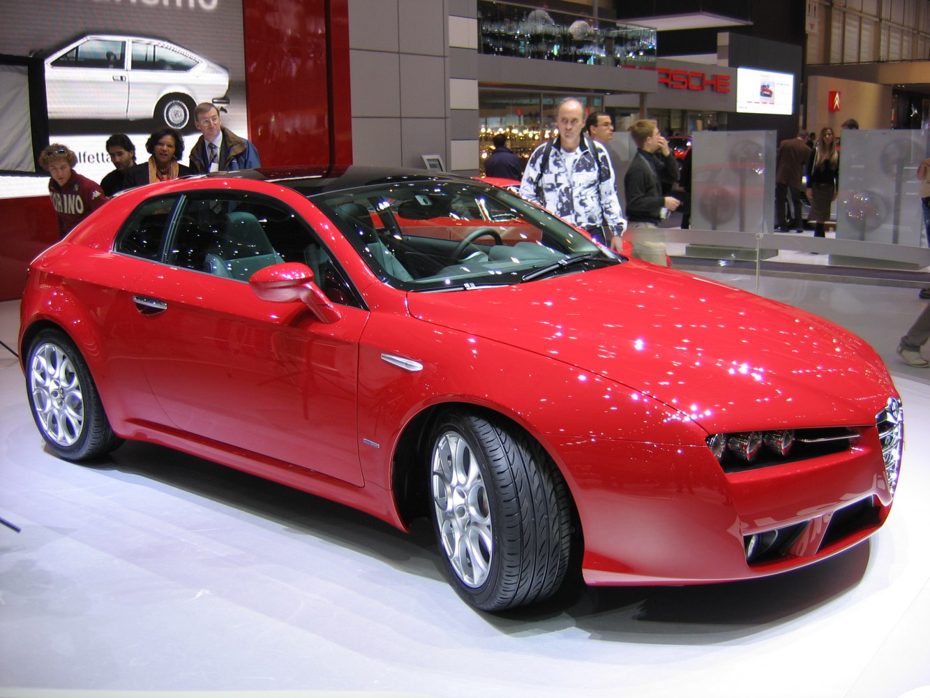 Red sports coupe with distinctive front grille and alloy wheels