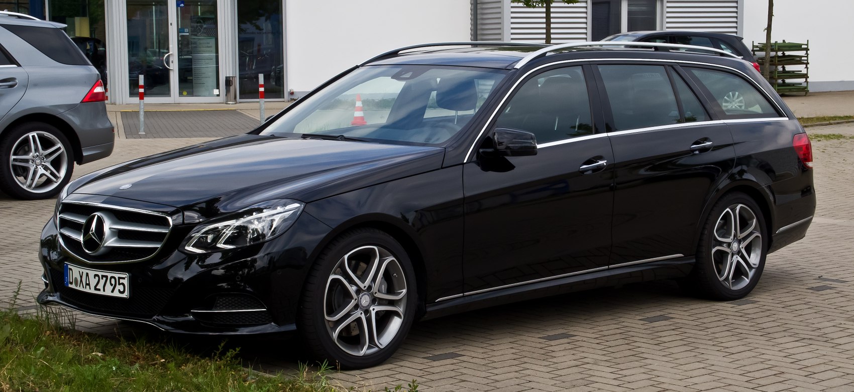 Black luxury station wagon with sleek headlights and alloy wheels