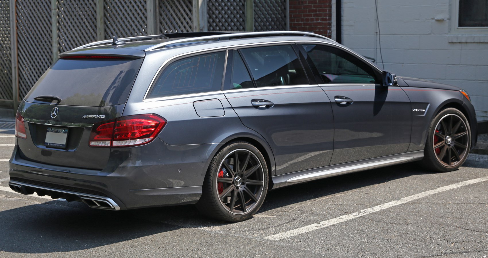 Rear and side view of a sporty station wagon with AMG wheels.