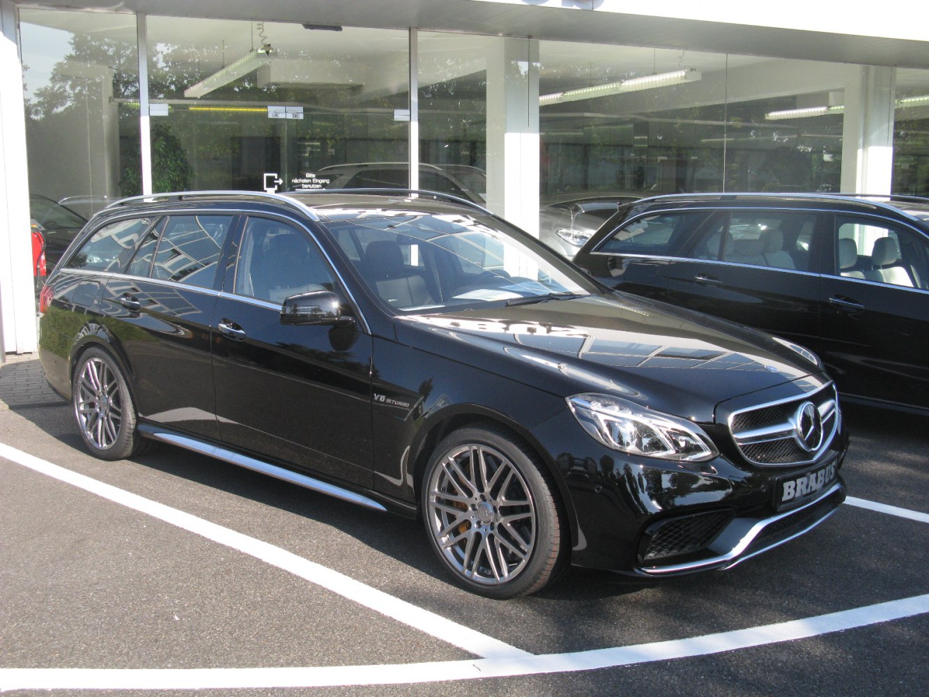 Black estate with AMG front grille and multi-spoke alloy wheels