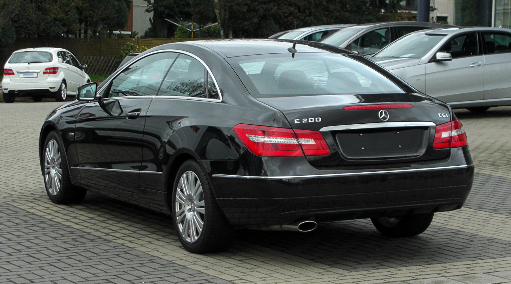 Rear and side profile with distinct tail lights and chrome trim