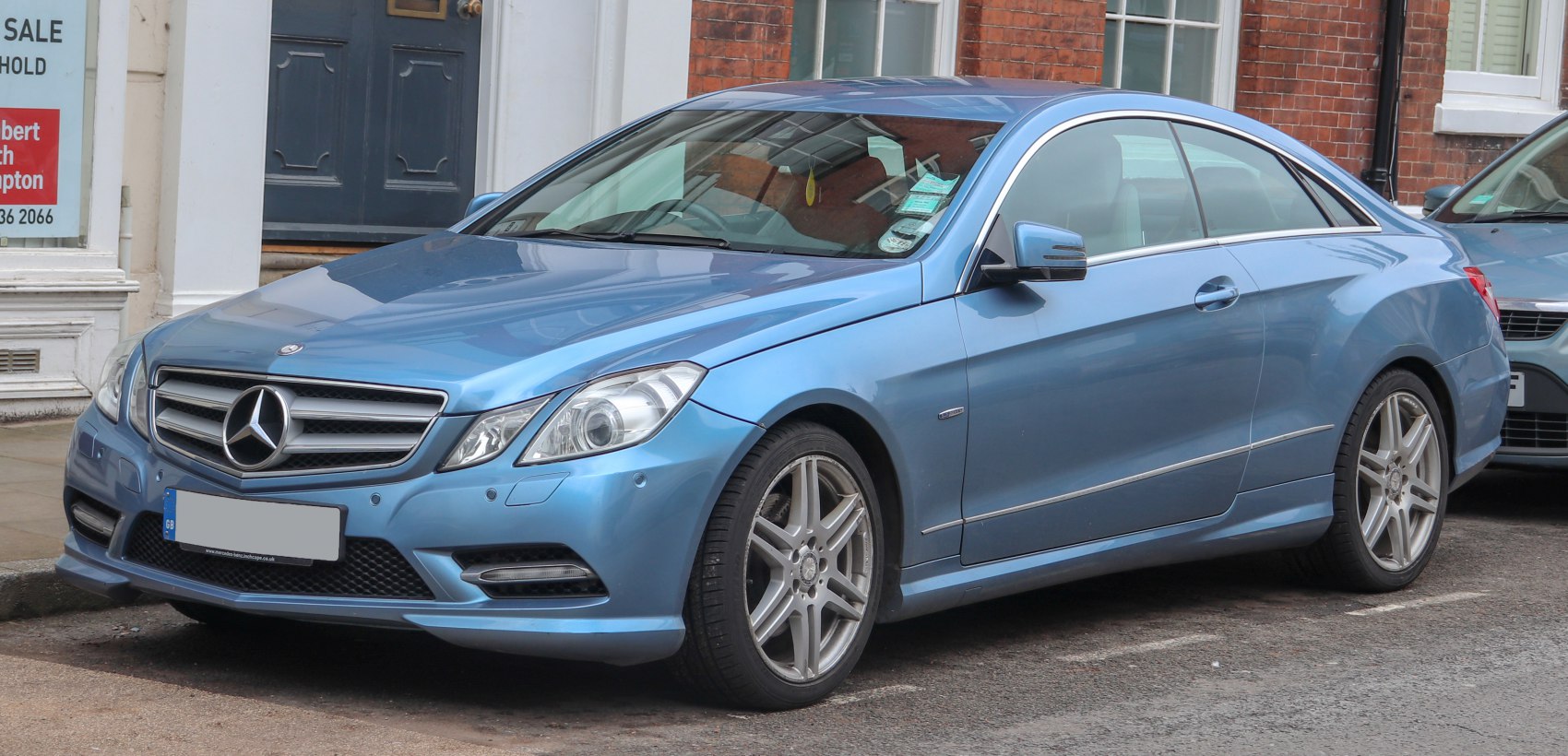 Blue coupe with AMG wheels and LED daytime running lights
