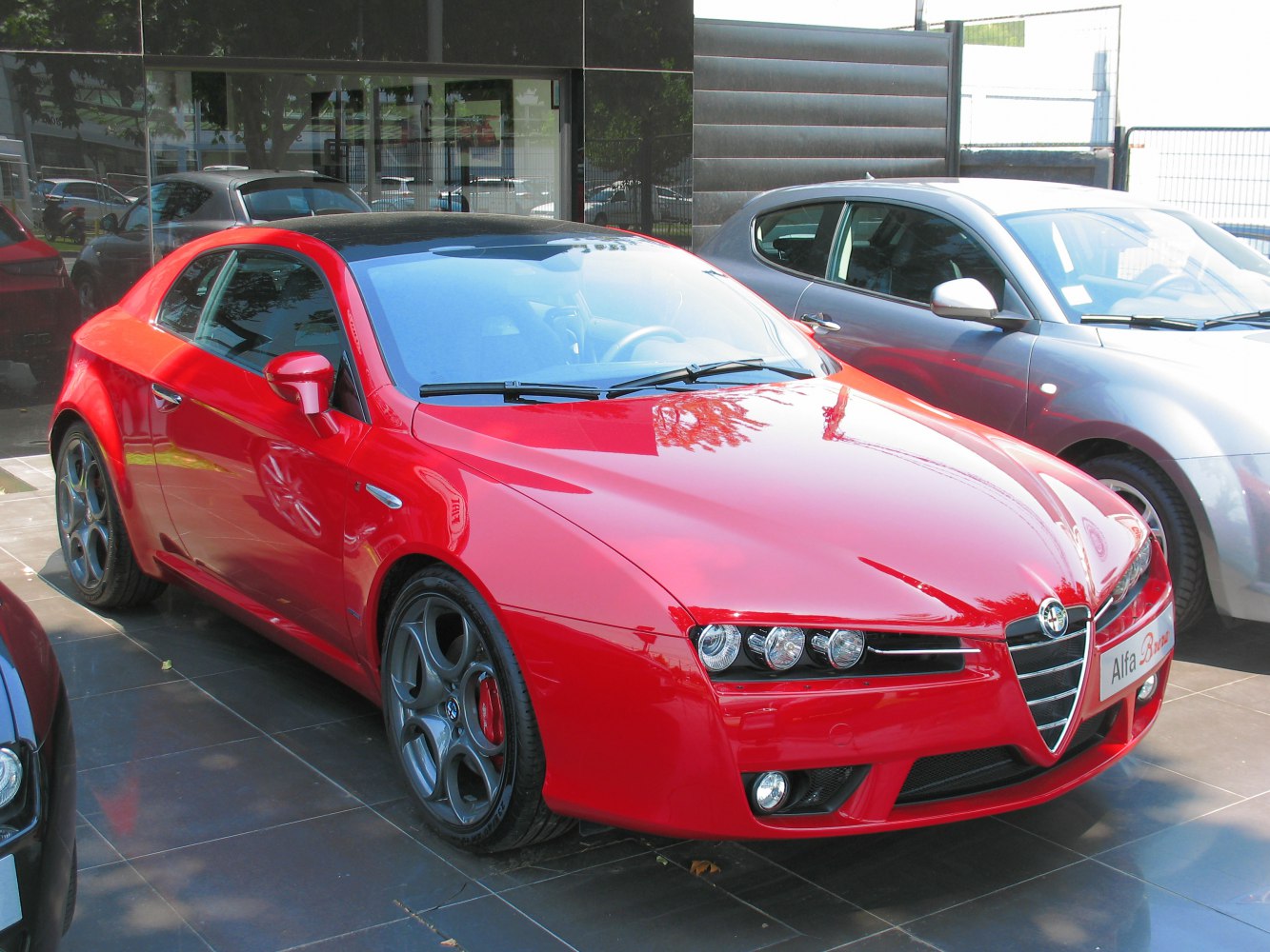 Front view focusing on distinctive triple headlights and iconic grille