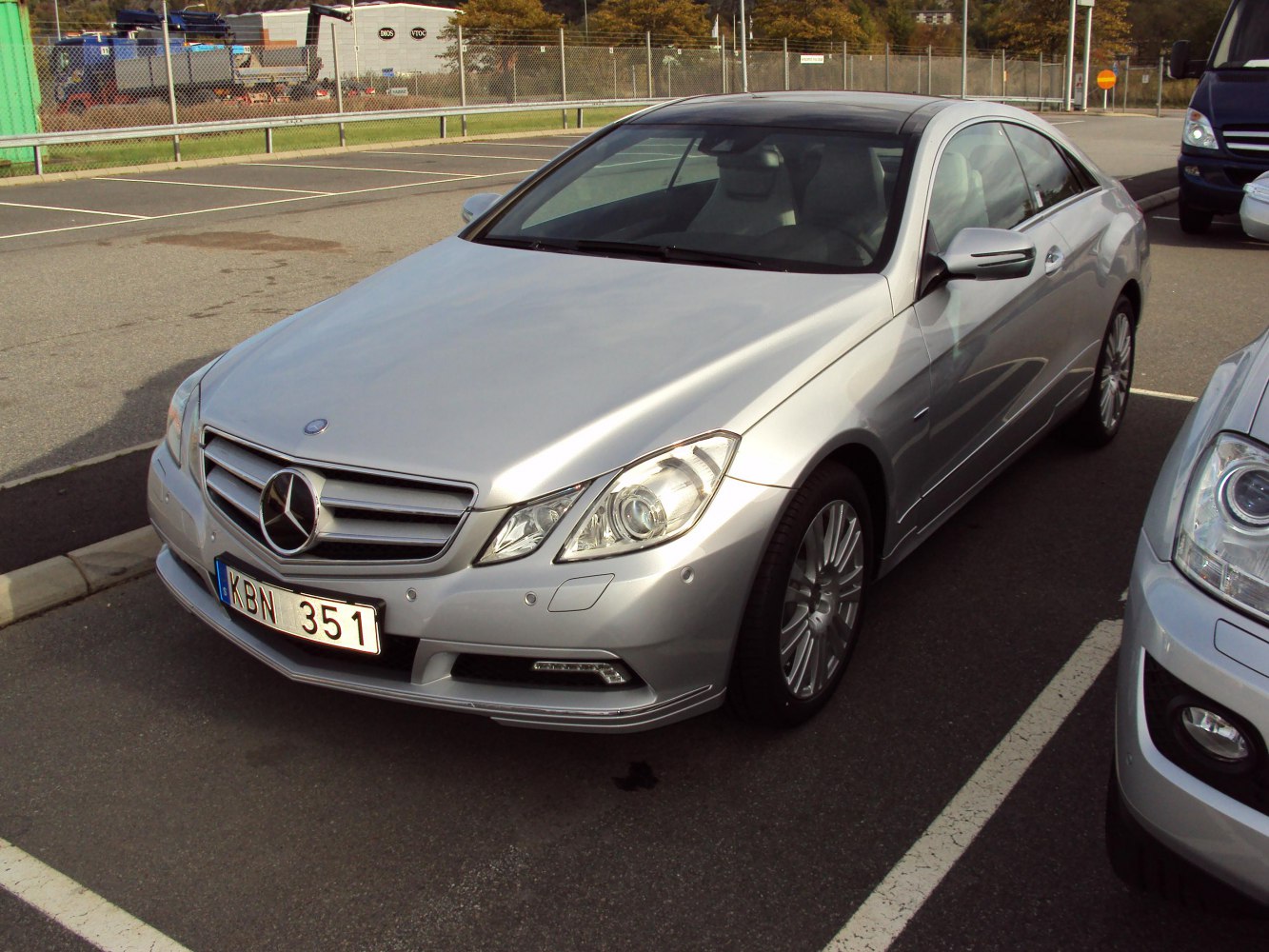Silver coupe with refined front grille and angular headlights