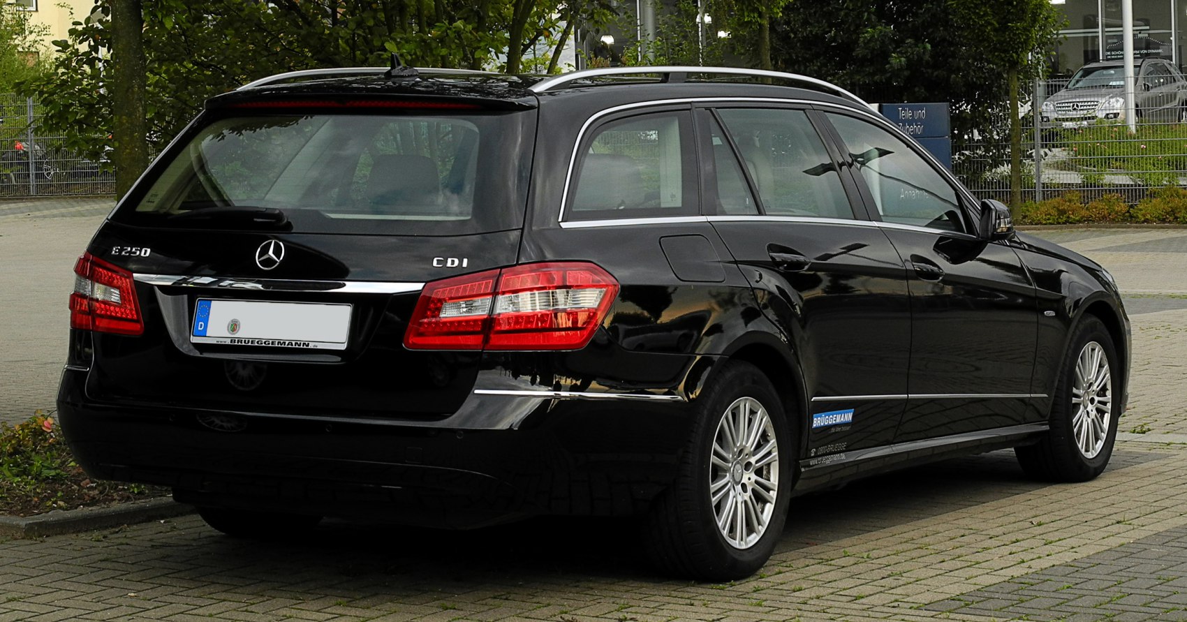 Rear view of station wagon with distinct taillights and roof rails