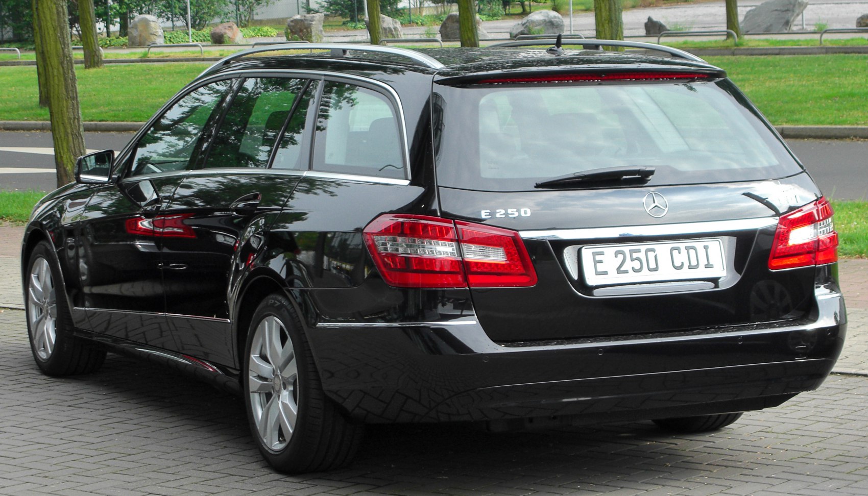 Rear view of station wagon with tail lights and roof rails