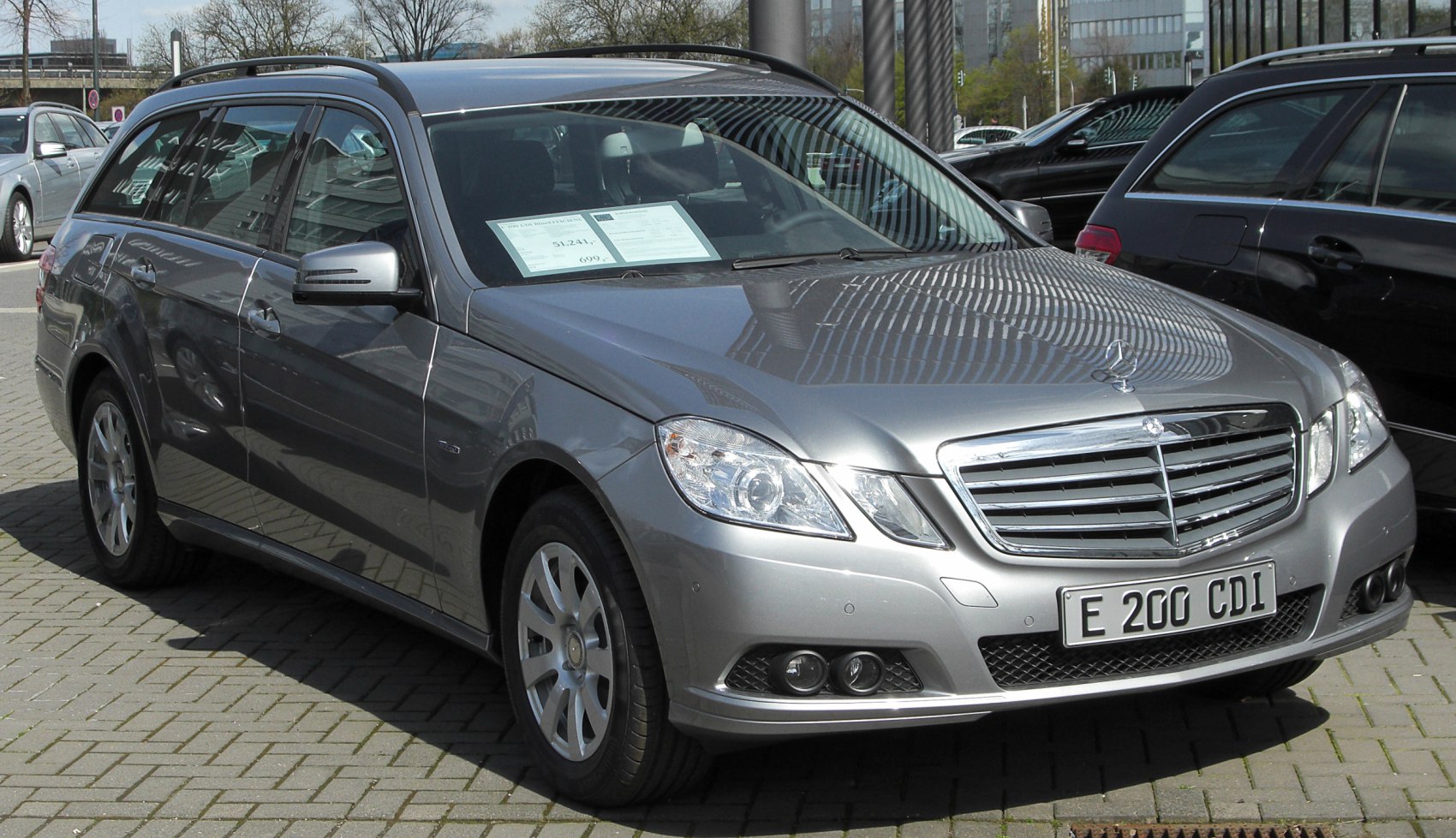 Front and side view of a station wagon with chrome grille and large headlights.