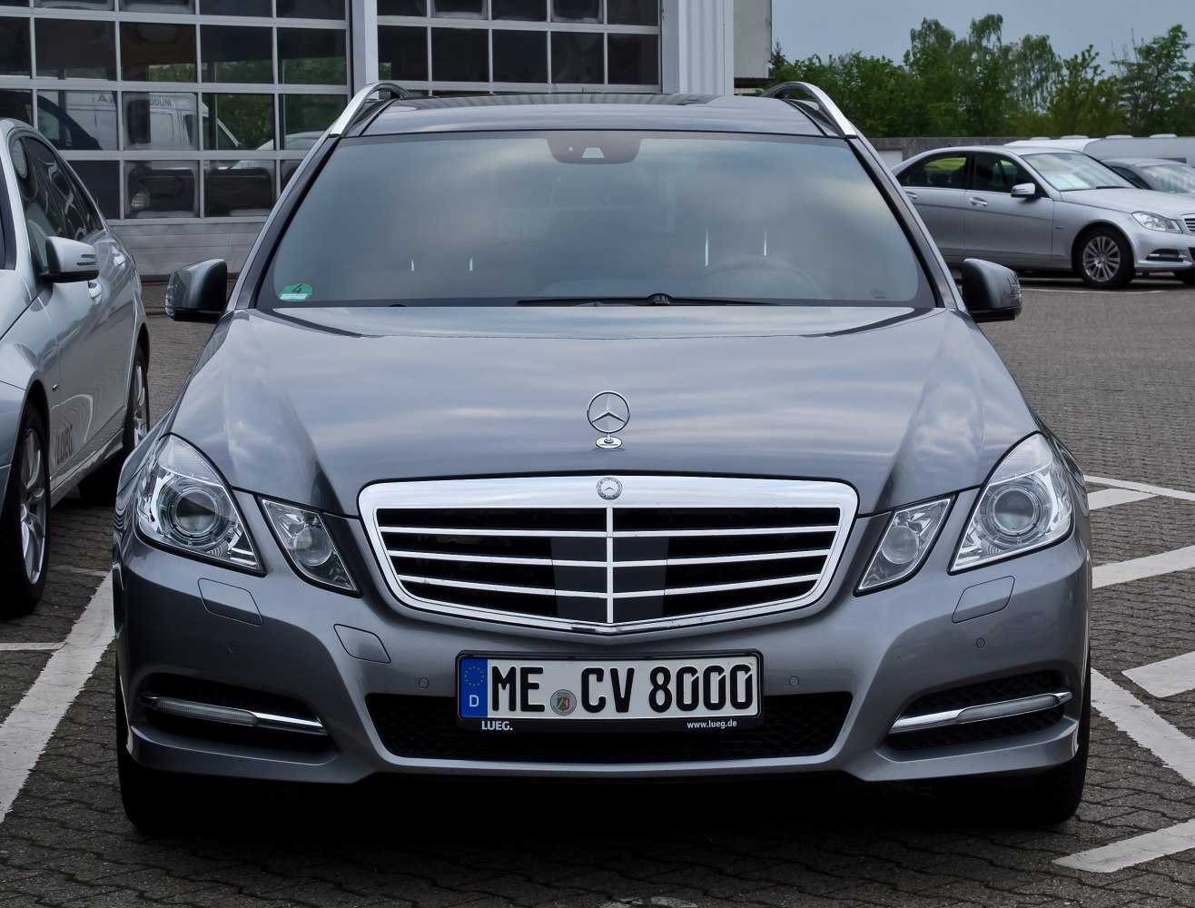 Front view of luxury station wagon with chrome grille and LED headlights