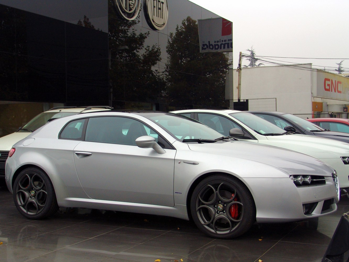Silver coupe with distinctive multi-spoke alloy wheels