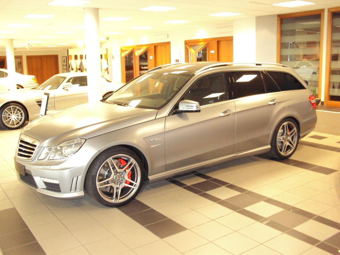Silver metallic sports wagon with AMG wheels and red brake calipers