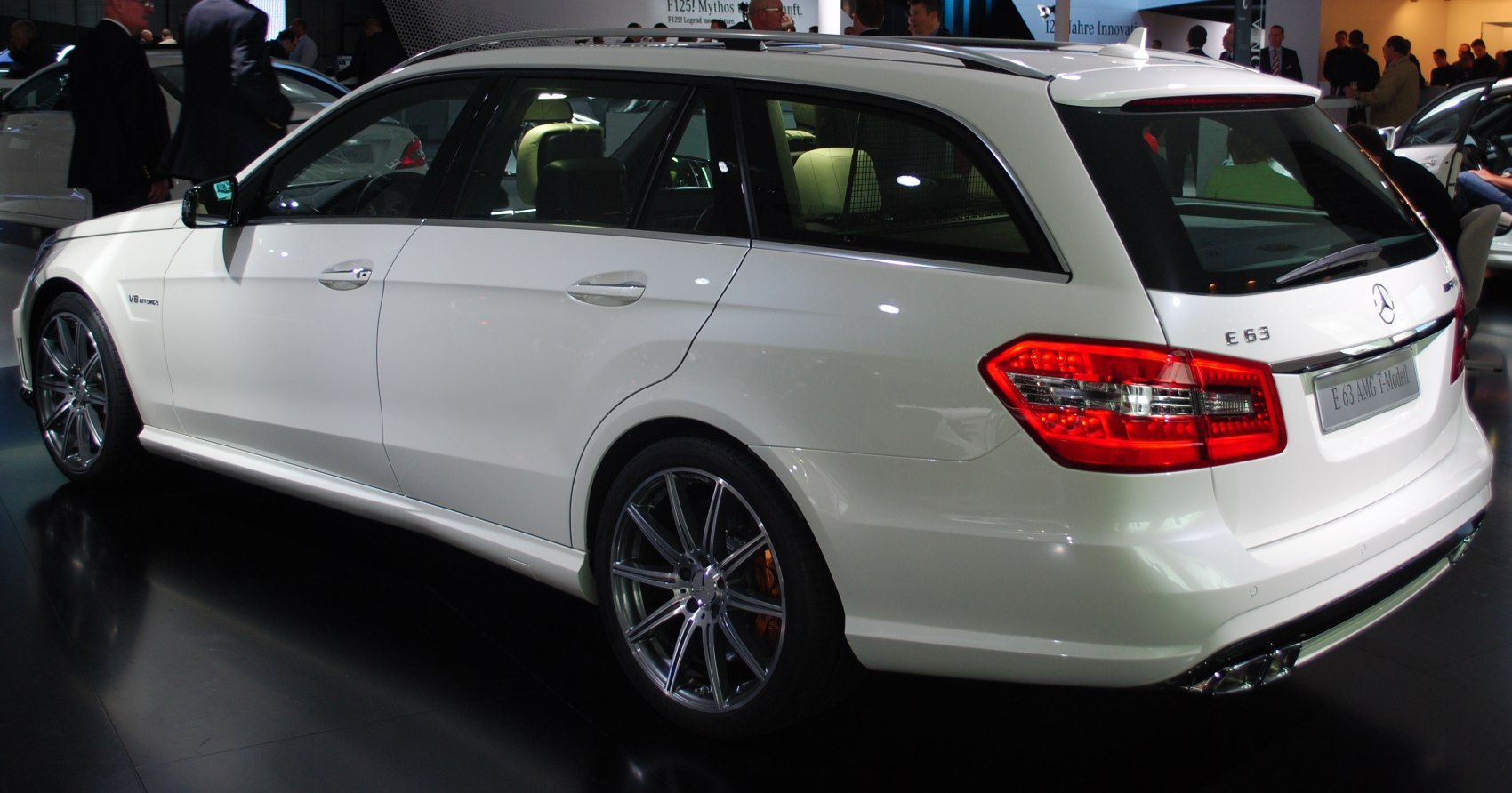 Rear and side view of white estate with V8 AMG badge and alloy wheels