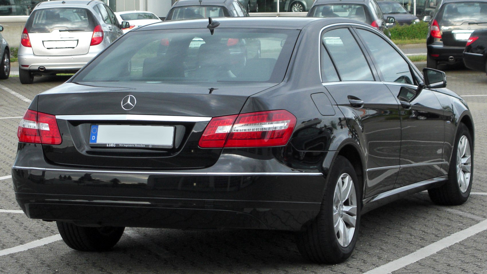 Rear view of a 2010 sedan with signature tail lights and chrome trim