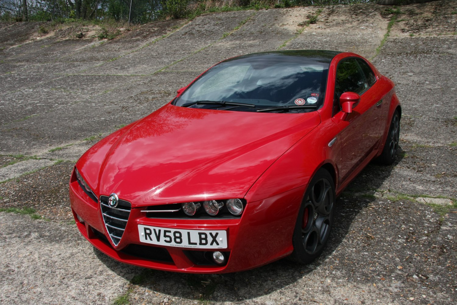 Front view with tri-group headlights and Alfa Romeo grille