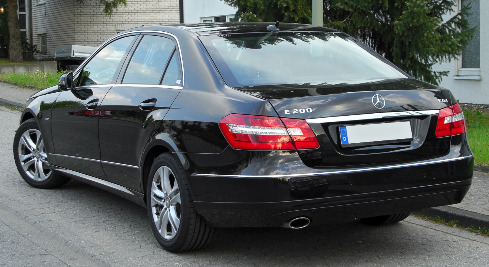 Rear view of a sedan with LED tail lights and single exhaust pipe