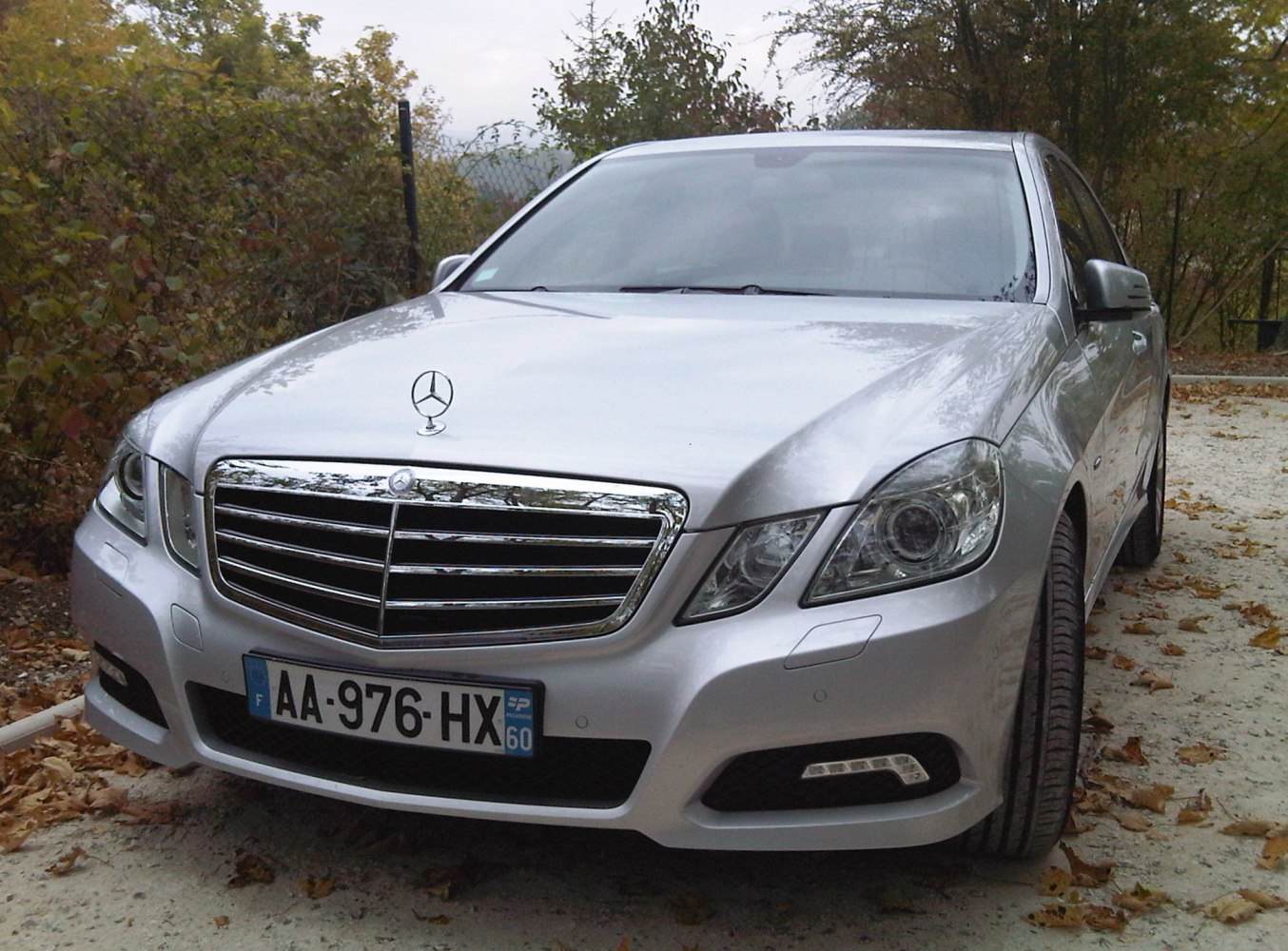 Front view with prominent chrome grille and detailed headlights